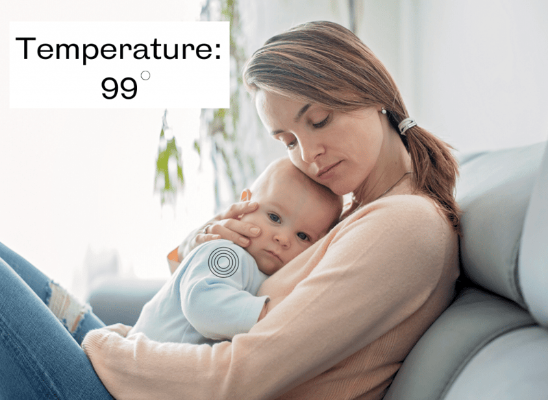 mother holding baby, temperature written on image