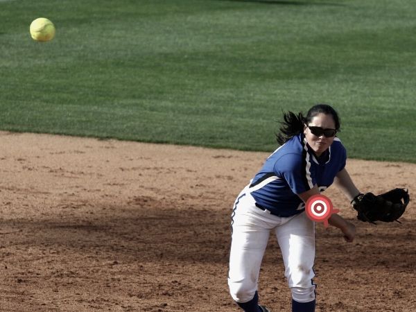 Girl throwing softball 