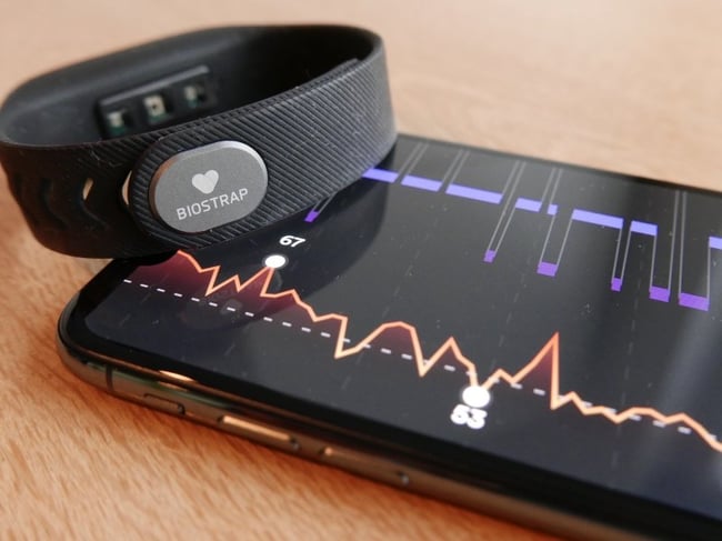 Biostrap wearable wristband and information being displayed on a phone screen.