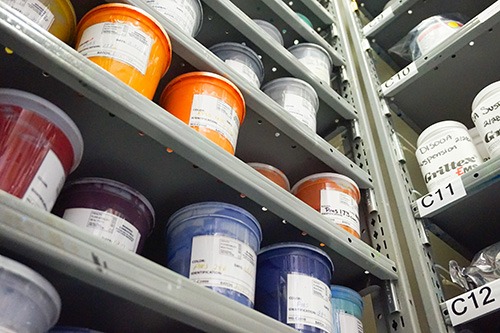 conductive inks sitting in their cans on shelves