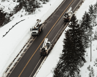 utility workers in their trucks in the winter