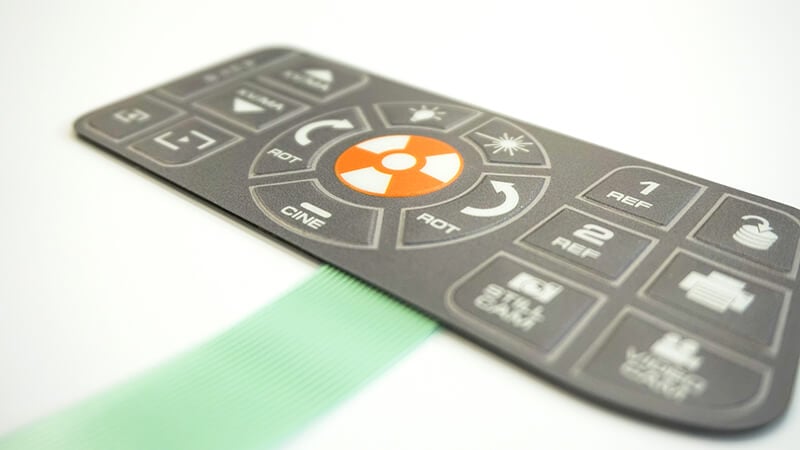 membrane switch design with a tail laying on a white background