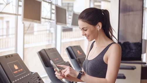 Girl on Phone while working out