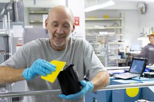 man posing at work, material and inks